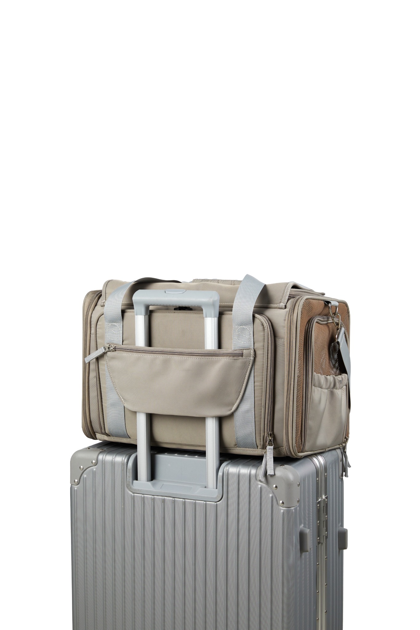 Rear view of the gray Wander Meow carrier fitted over an extended suitcase handle through its luggage sleeve.